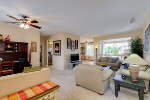 Living room, den and view into the dining area (before new flooring and paint)