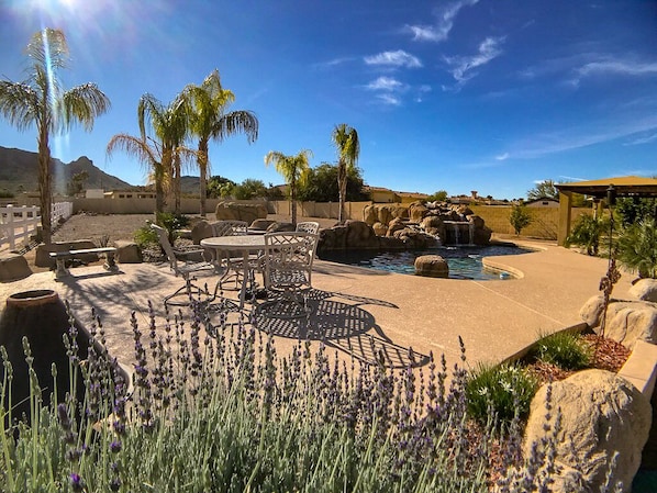 Resort style pool and spa with gas fire pit.