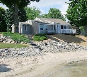 Picture of cottage from the water during low water.