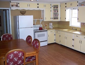 Kitchen offers a perfect blend of cozy comfort and modern convenience.