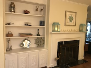 Den cabinets and fireplace. There is a queen sofa pullout here