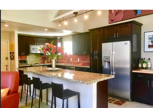 Kitchen 16 foot granite island condo is 1200 sq ft 2bed 3 bth Upper Unit. Quiet 