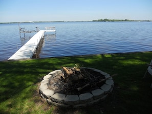 Pier with boat lift and outdoor fire pit