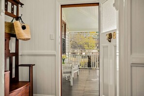 Front door to home onto latticed front veranda