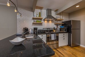 Fully stocked kitchen with granite countertops