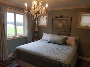 Bedroom with a King size bed and luxury linens.  