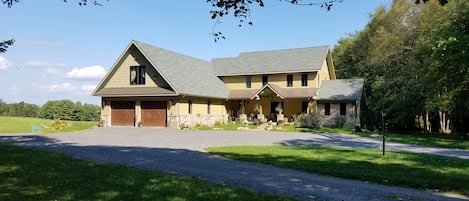 The Suite parking is to the left of the house beyond the garage