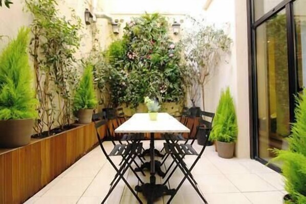 Outdoor patio and green wall