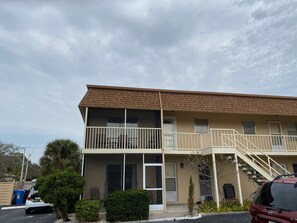 View of property from parking lot 2nd floor corner unit