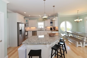Kitchen with stainless appliances, granite counter tops, and a center island