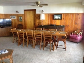 Dining area in great room on lake side.  Large table for 10 guests.