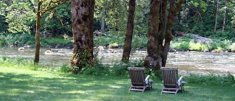 A river runs through the back yard at Sol Duc Riverside Cottages