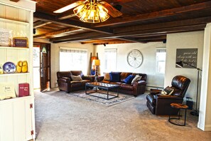 Family room with plenty of space and seating to relax, talk, watch a show