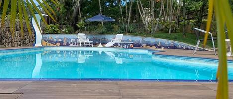 Piscina com cascata na Sonho Meu Hospedaria, Lagoa da Conceição, Florianópolis