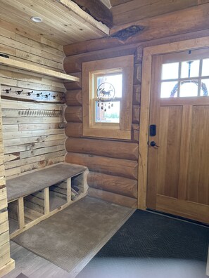 Entryway with seating, cubbies and coat hooks