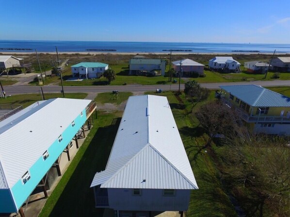 Aerial view facing the beach, note beach crossover to the left