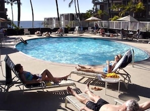 The pool is just above the BBQ.