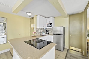 Fully equipped kitchen with coffee maker, blender, kettle, toaster, microwave and rice cooker