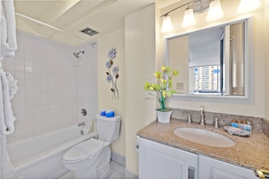 Full Bathroom with tub and shower combination.
