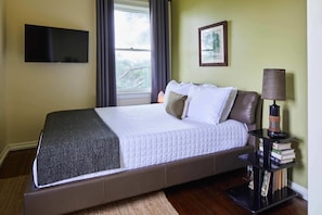 The master bedroom is earthy and warm, a great place to relax from the day. You'll fall in love with the queen size memory foam bed while you indulge your inner pillow queen with plenty of comfy hypoallergenic pillows.