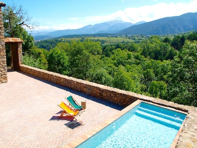 Chlorine-free pool of villa Cal Pesolet, with wild forest mountains panorama 