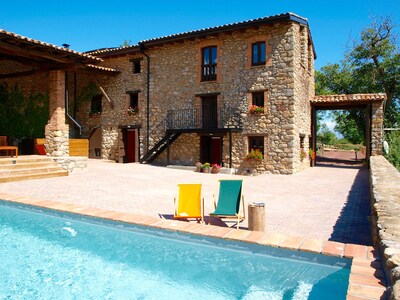 Villa Cal Pesolet in summer, with private patio, porch and pool.