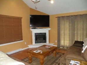 propane fireplace with remote ,flat screen tv.,sectional sofa with elect.lounges