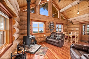 Entering into Falls Ridge cabin. Living space and table.