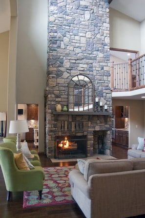 Wood burning fireplace heats the main level with additional radiant heating 