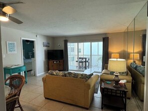 Take in the cool ocean breeze in your living room that opens directly to lanai.