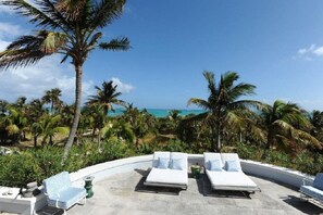 Patio with ocean views, 100 feet from your pink-sand beach.