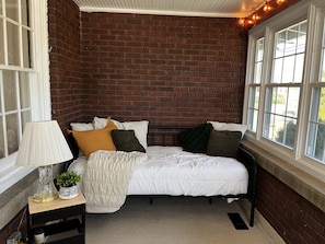 Twin daybed in the sunroom for relaxing