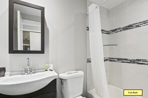 Elegant, second floor full-bathroom, features a white marble shower