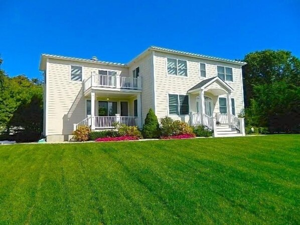 Beautifully maintained front yard perfect for games! 2 front porches, 1 in back.