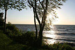Views at sunset from the deck and house. 
20 steps down the bluff to the beach.