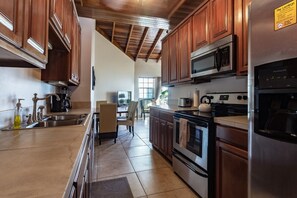 Galley kitchen with stainless steel appliances