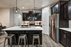 Kitchen Island - The Kitchen Island comfortably seats 3 adults and creates a great space for serving and preparing meals.