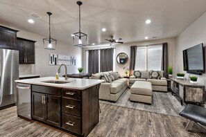 Kitchen View - The Living Room is located adjacent to the dining room and is the perfect place to relax and watch your favorite movie or TV program.