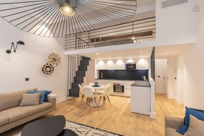 Living-room with open plan kitchen