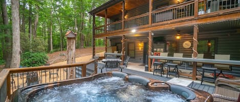 Amazing backyard with hot tub, fire pit, multiple decks, and yard games