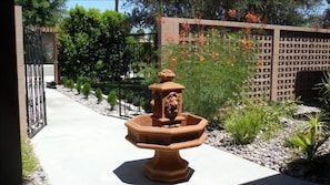Immaculate grounds surround you in your private courtyard with working fountain