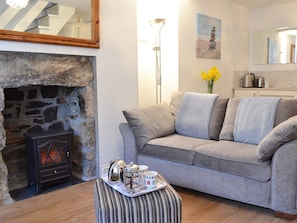 Open plan living area with electric woodburner | Salty Cottage, Newlyn, near Penzance