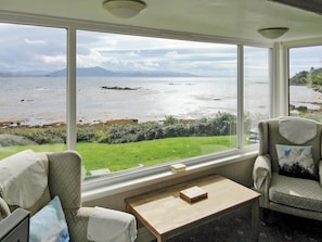 Wonderful, far reaching views from the living room | Macinnisfree Cottage, Saasaig, Teangue, Isle of Skye