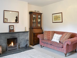 Spacious living room with an open fire | Roundhill Cottages 1, Grasmere
