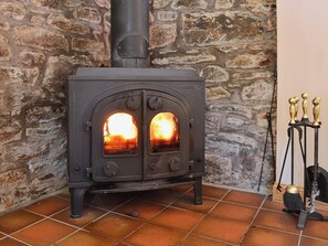A traditional woodburning stove provides extra charm, as well as warmth | Arkland Mill - Crofts Cottages, Near Castle Douglas
