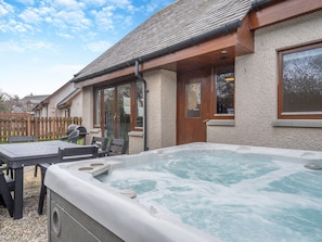 Relax in the lovely hot tub | Croftside House - Allt Mor Cottages, Aviemore