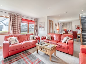 Comfortable leather sofas in the living room | Croftside House - Allt Mor Cottages, Aviemore