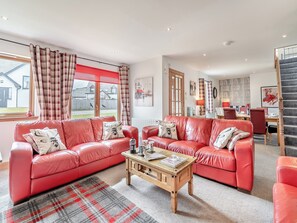 Comfortable leather sofas in the living room | Croftside House - Allt Mor Cottages, Aviemore