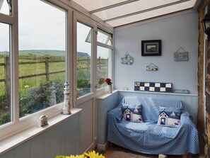 Conservatory and dining room | Sea Breeze Cottage, Cowbar, near Staithes
