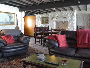 Living room with dining area | Porth Colmon Farmhouse, Porth Colmon, near Pwllheli